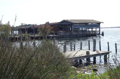 a house on a dock on the water at Maison INDEPENDANTE entre mer et montagne in Prunelli-di-Fiumorbo