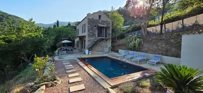 a swimming pool in the backyard of a house at La Casuccia in Venzolasca