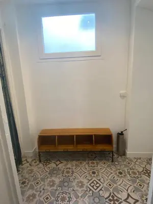 a bench in a room with a window at Superbe Appartement au coeur d ajaccio in Ajaccio