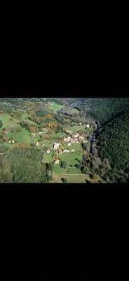 an aerial view of a city with trees and houses at U San Petru -Locations de chambres in Bains de Guitera