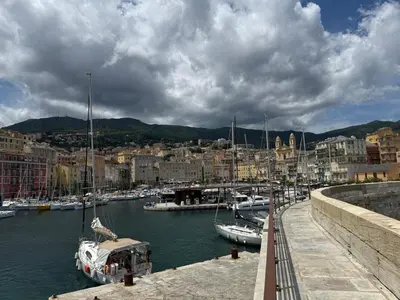 a group of boats docked in a harbor at Agapanthe location in San-Nicolao