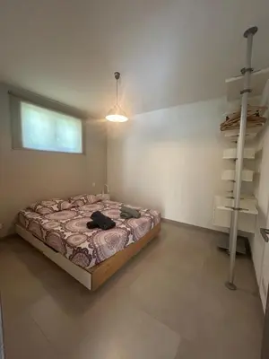 a bedroom with a bed and a shelf in it at Vacances Bonifacio Bergerie in Bonifacio