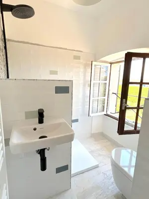 a bathroom with a sink and a toilet at L'appartement Montecristo in Aléria