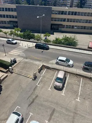 an overhead view of a parking lot with cars parked at Appartement Ajaccio private parking in Ajaccio