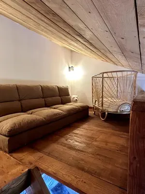 a living room with a couch and a basket at Villa in nature & heated pool - Figari in Figari
