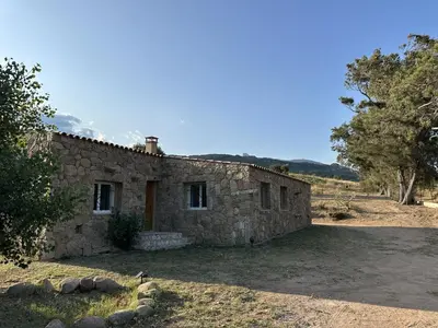 an old stone house in the middle of a field at Villa in nature & heated pool - Figari in Figari