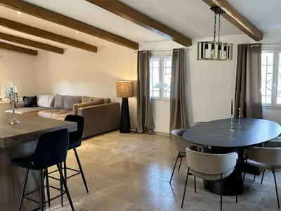 a living room with a table and a couch at Villa in nature & heated pool - Figari in Figari