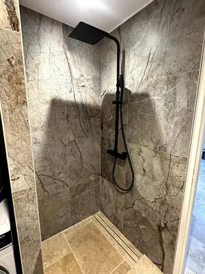 a bathroom with a shower with a glass door at Villa in nature & heated pool - Figari in Figari