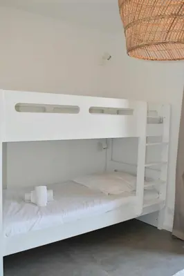 a white bunk bed in a room at Bergerie avec piscine chauffée Sotta in Sotta