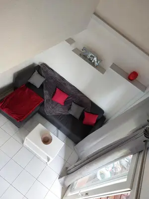 an overhead view of a room with two beds and red pillows at Marina-Di-Pinarello Corse-du-Sud à 400m de la plage Pinarellu in Zonza