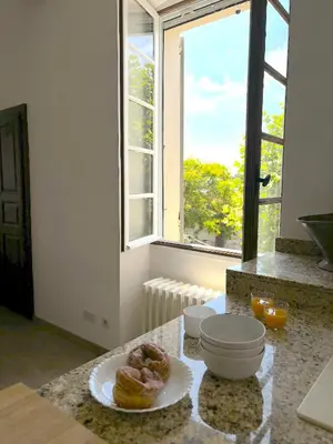 a kitchen with a plate of donuts on a counter at L'appartement Montenosa in Aléria