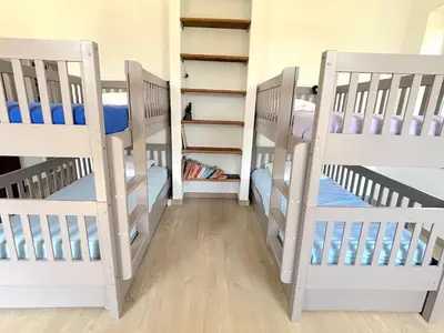 a couple of bunk beds in a room at L'appartement Montenosa in Aléria