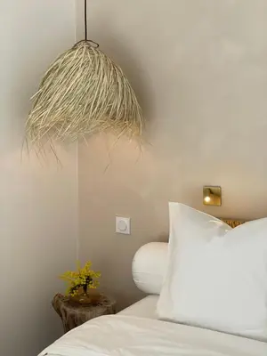 a bedroom with a white bed and a pendant light at La Villa Geneviève, Maison 6 personnes avec piscine in Calenzana