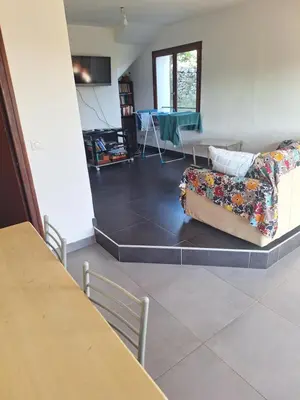 a living room with a couch and a table at Casa di Purgu in Sotta