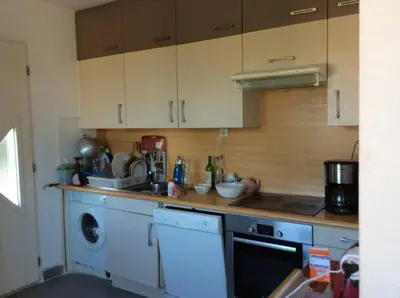 a kitchen with a sink and a washing machine at Casa di Purgu in Sotta