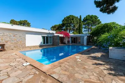 a swimming pool in the backyard of a house at Parad'Isula - Avec piscine à Porticcio in Grosseto-Prugna