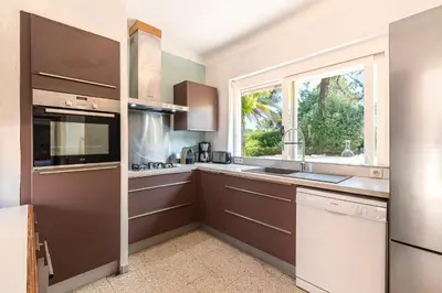 a kitchen with a sink and a window at Parad'Isula - Avec piscine à Porticcio in Grosseto-Prugna
