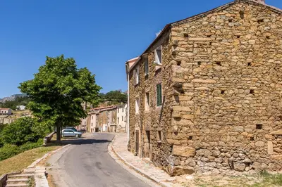 a stone building on the side of a road at A Sant'Anna in Albertacce