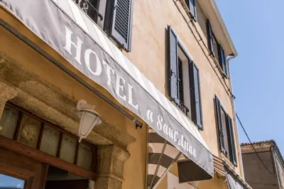a sign on the side of a building at A Sant'Anna in Albertacce
