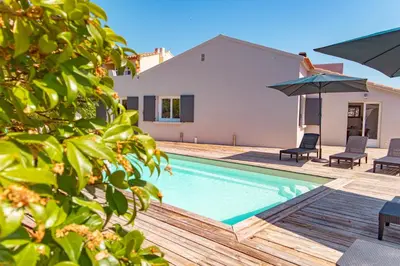 a villa with a swimming pool and a house at Villa Lisa Porto-Vecchio in Porto-Vecchio