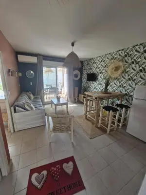 a living room with a couch and a table at Casa Verde Poggio Mezzana in Poggio-Mezzana