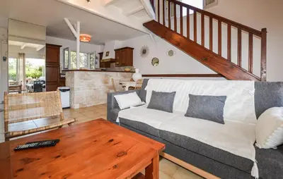 a living room with a couch and a table at 2 Bedroom Gorgeous Home In Prunete in Prunete