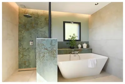 a bathroom with a white tub and a shower at Villa neuve perchée - Vue splendide in Zonza