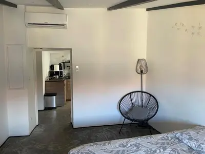 a room with a bed and a lamp in it at Studio Ajaccio Centre in Ajaccio