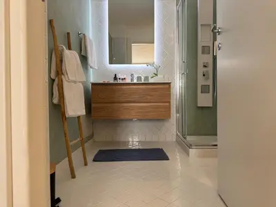 a bathroom with a sink and a mirror at B&B Les Capitaineries in Bonifacio