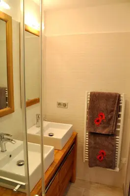 a bathroom with a sink and a mirror at Magnifique villa avec piscine chauffée, vue mer et montage in Porto-Vecchio