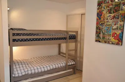 a small room with a bunk bed in it at Magnifique villa avec piscine chauffée, vue mer et montage in Porto-Vecchio