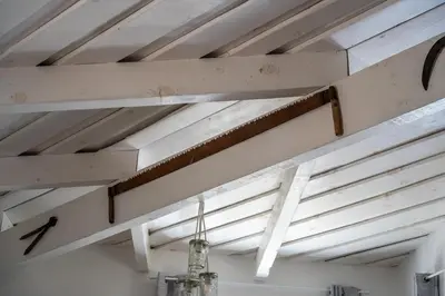 a ceiling with wooden beams in a room at La bergerie 1 in Bonifacio