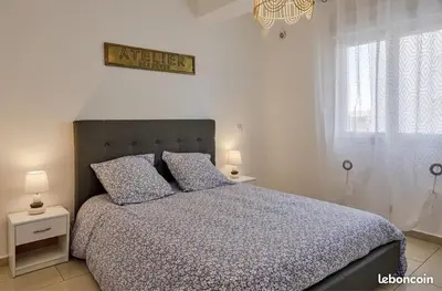 a bedroom with a large bed with two pillows at Appartement Lucciana Corse plage à 2 minutes in Lucciana