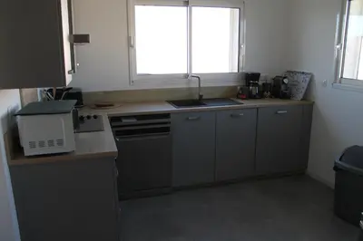 a kitchen with a sink and a counter top at Villa Nova in Aléria