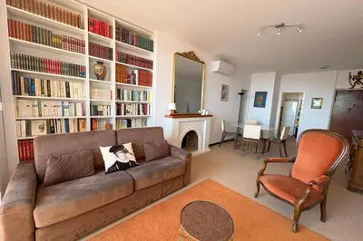 a living room with a couch and a fireplace at Fage - Panoramic view Spacious Luminous - by TGB in Ajaccio