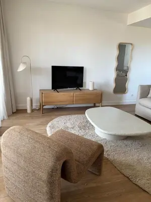 a living room with a couch and a tv at T2 - sea and Corsican maquis in Bonifacio