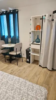 a room with a table and a table and a chair at Casa Squarcini in Appietto