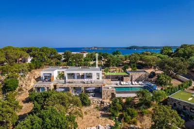 an aerial view of a house with a view of the ocean at Villa Cala Serena in Zonza