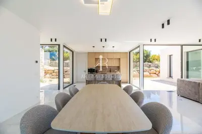 a conference room with a table and chairs at Villa Cala Serena in Zonza