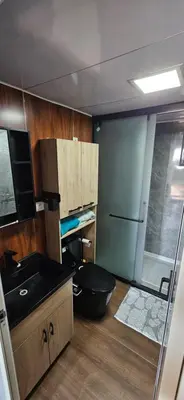a small kitchen with a sink and a refrigerator at Grande Chambre tout confort 5 in Bonifacio
