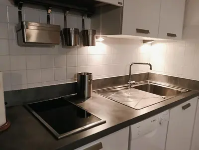 a kitchen with a sink and a counter top at Le Rêve de Mer in Ghisonaccia