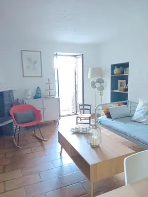 a living room with a couch and a coffee table at Entre mer et montagne in Valle-di-Campoloro
