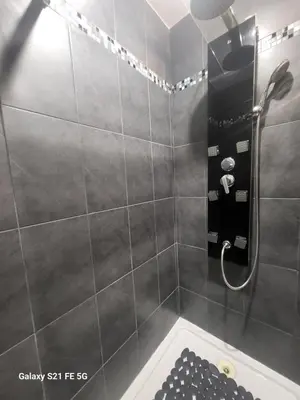 a bathroom with a shower with a bath tub at T2 Ajaccio centre in Ajaccio