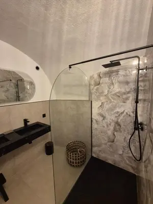 a bathroom with a shower and a sink at Appartement de charme - Nebbiu in Vallecalle