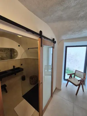 a bathroom with a glass shower in a room at Appartement de charme - Nebbiu in Vallecalle