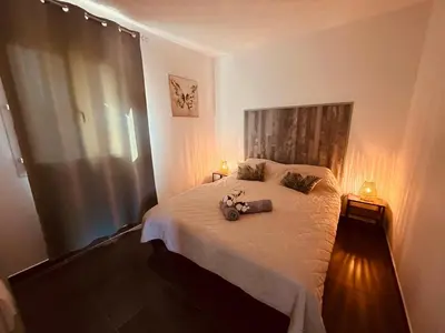 a bedroom with a bed with a stuffed animal on it at Villa Cala Longa - Porto Vecchio in Sotta