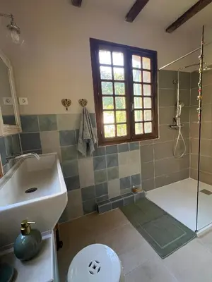 a bathroom with a sink and a shower at To a Book House in Corsica - chambres d'hôtes in Oletta
