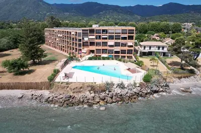 an aerial view of a resort with a swimming pool at Casa Santa Lucia - Climatisé au bord de Mer in Santa-Lucia-di-Moriani