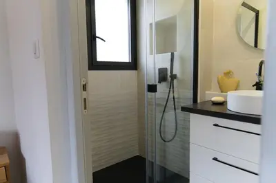 a bathroom with a shower and a sink at A Casa Catalina - Charming villa in Afa