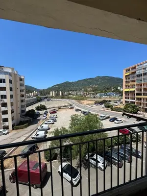 a view of a parking lot from a balcony at F3 parking gratuit Clim port 5min aéroport 10min in Ajaccio